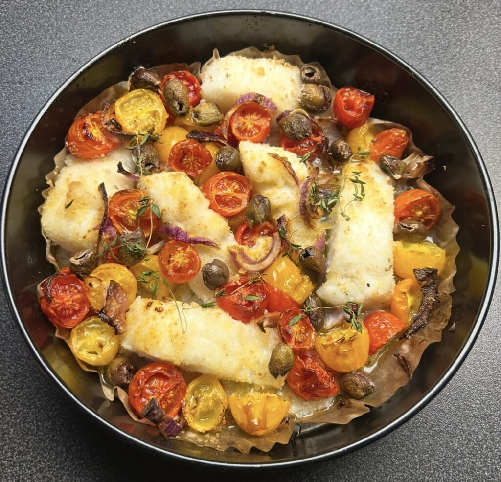 Filetti di baccalà gratinati con pomodorini e olive taggiasche